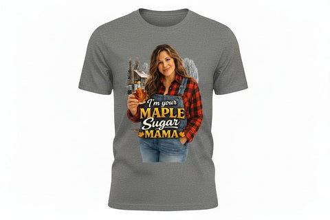 Grey Gildan DryBlend t-shirt with a graphic of a woman in overalls and a red plaid shirt holding a maple leaf bottle of syrup. Text reads "I'm Your Maple Sugar Mama."