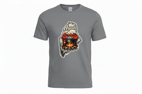 Gravel colored t-shirt with a graphic of the state of Maine containing a lobster pot over a fire with lobsters sitting inside and the words "Ayuh" and "The way life should be"