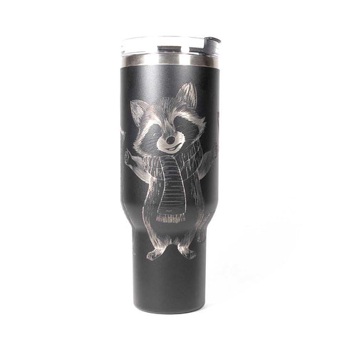 40 ounce black travel mug with three engraved raccoons dressed in scarves and hats. Side 1