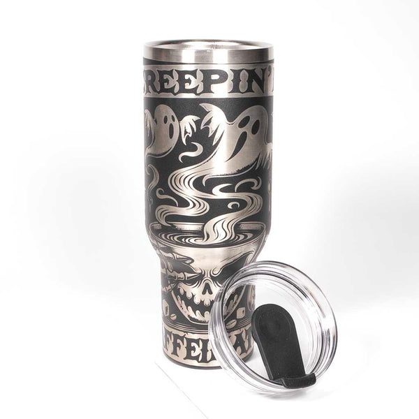 40 ounce black powder coated travel mug with Halloween-themed design and "Creepin it Caffeinated" text on a stainless steel background. Shown with cover and straw removed.