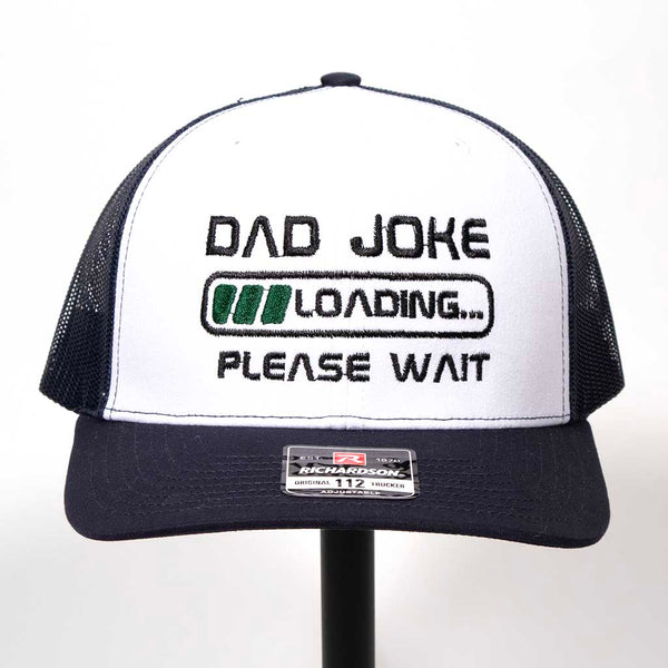 Black and white cap with 'Dad joke loading please wait' text on a white background. Richardson 112 hat. 