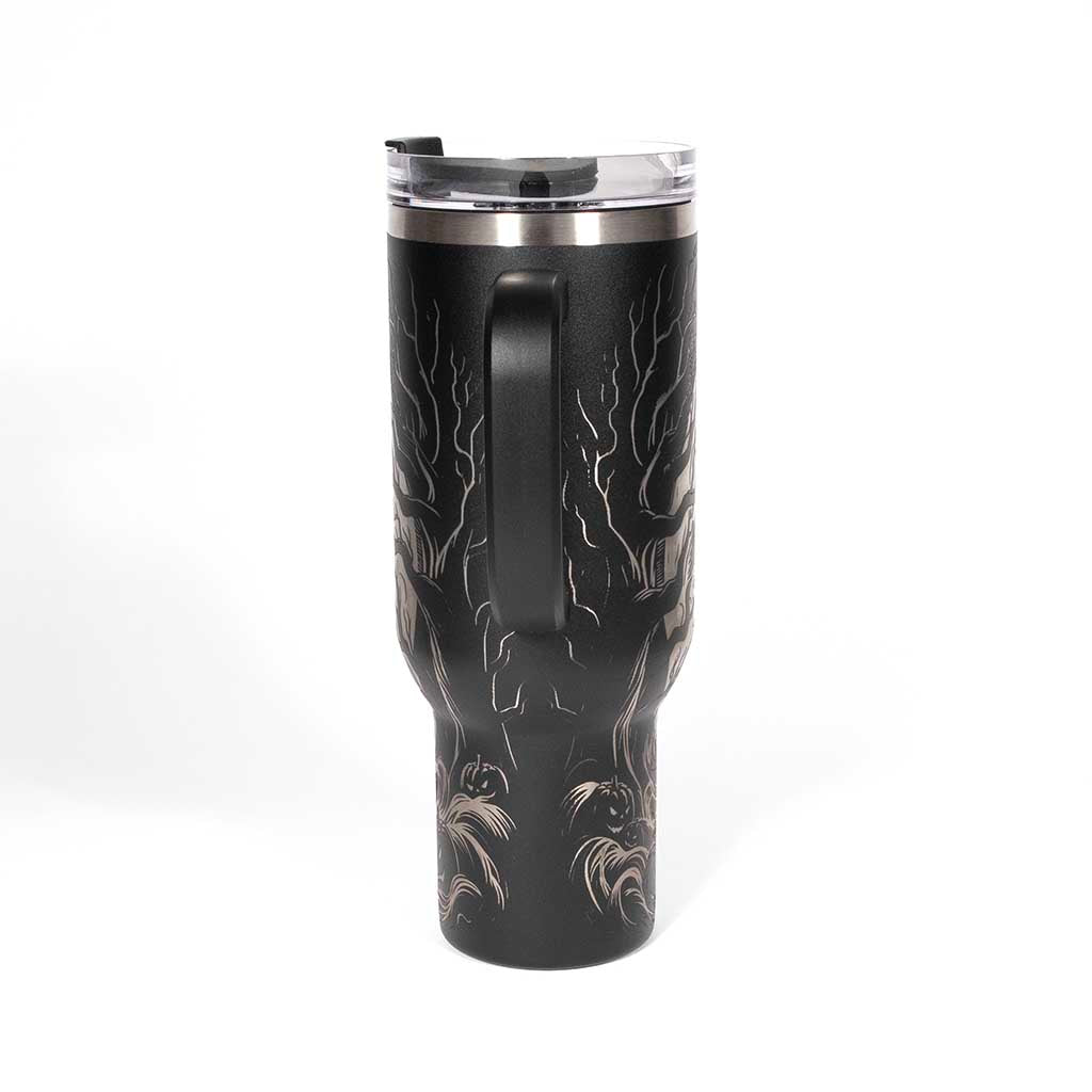 This is a black 40 ounce tumbler with a screw on lid with a drinking hole access and a straw. The laser engraving is of a headless horseman on his trusty steed. Side 4