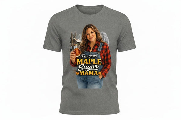 Grey Gildan DryBlend t-shirt with a graphic of a woman in overalls and a red plaid shirt holding a maple leaf bottle of syrup. Text reads "I'm Your Maple Sugar Mama."