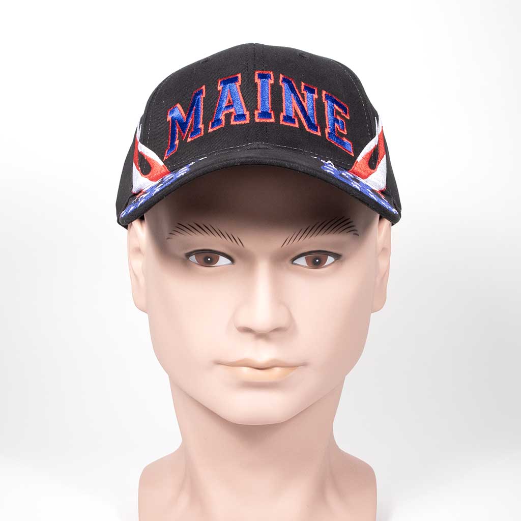 Black cap with 'MAINE' text and red, white and blue flame design on a mannequin head against a white background. Front view