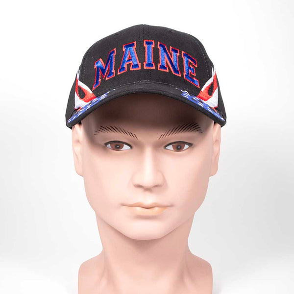 Black cap with 'MAINE' text and red, white and blue flame design on a mannequin head against a white background. Front view