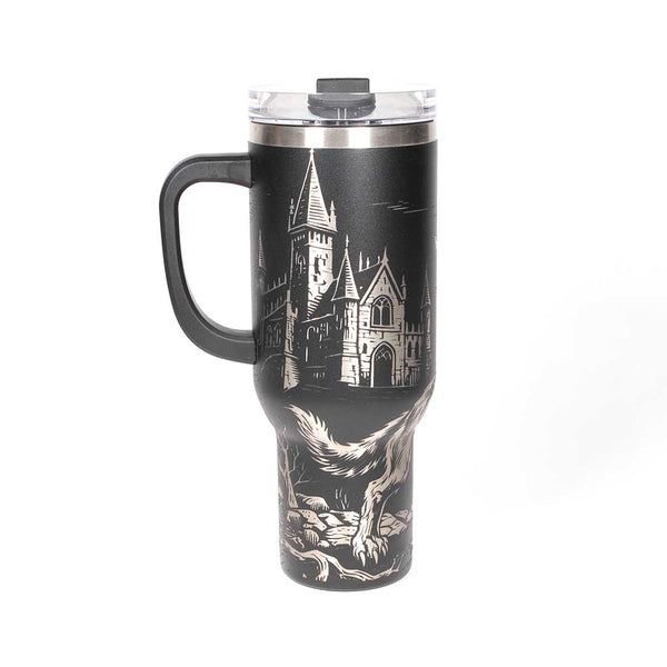 40 ounce travel mug with a werewolf, bats and a gothic cathedral design on a black background. Side 2