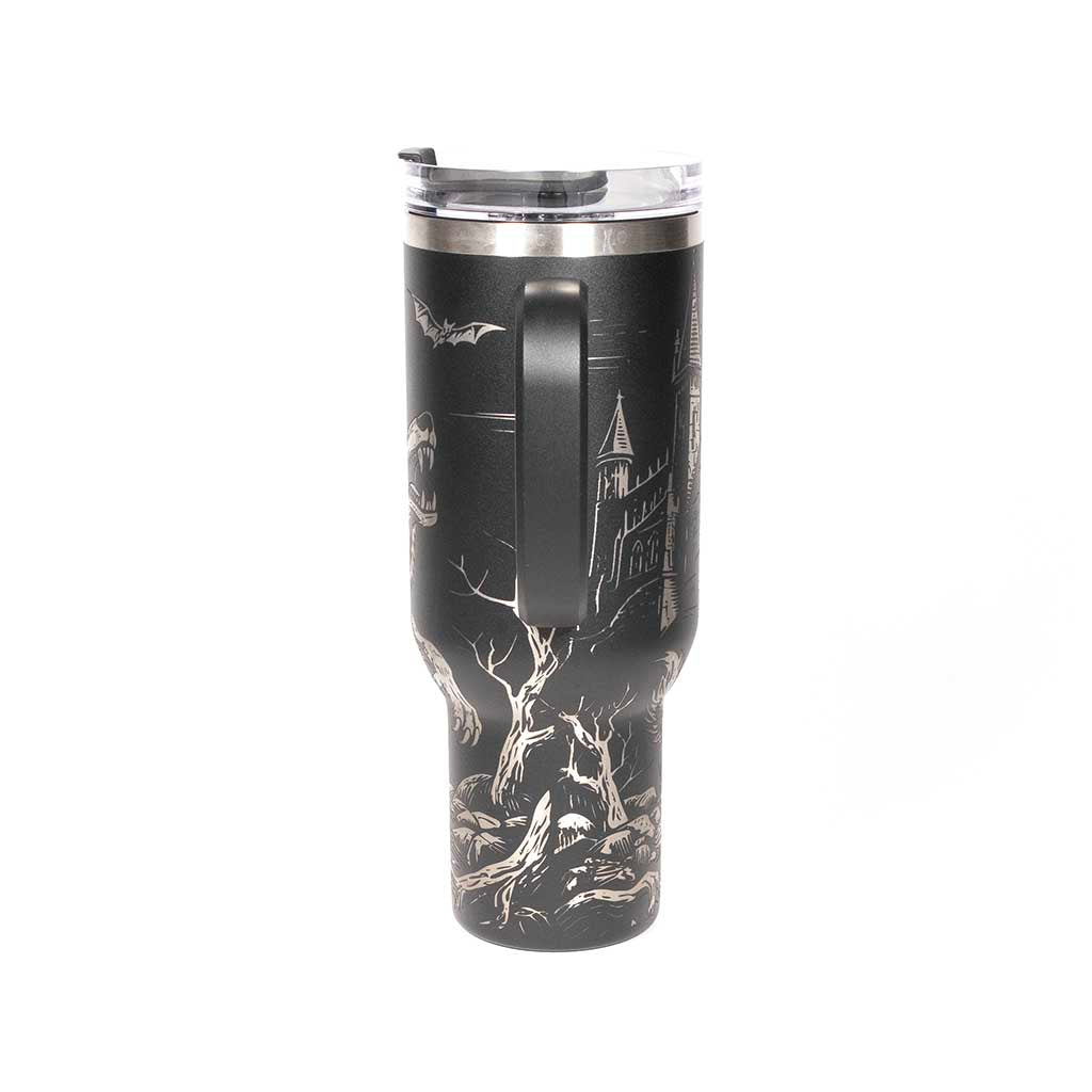 40 ounce travel mug with a werewolf, bats and a gothic cathedral design on a black background. Side 4