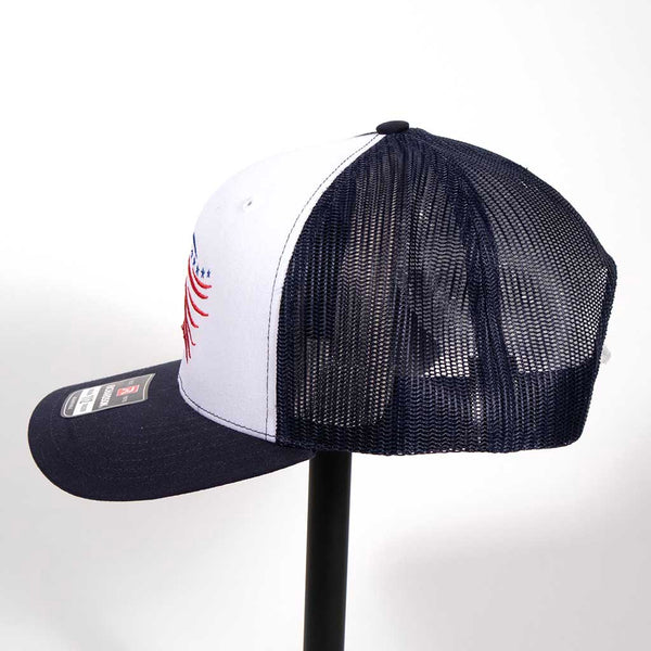 This is a Richardson 112 snap back hat with the outline of an eagles head. The head has been embroidered in blue and red stitching. From the left side.  