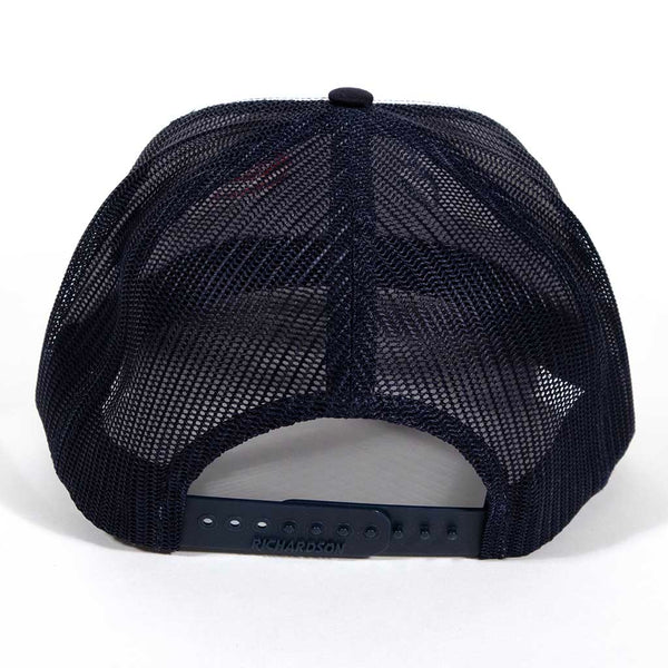 This is a Richardson 112 snap back hat with the outline of an eagles head. The head has been embroidered in blue and red stitching. From the back.