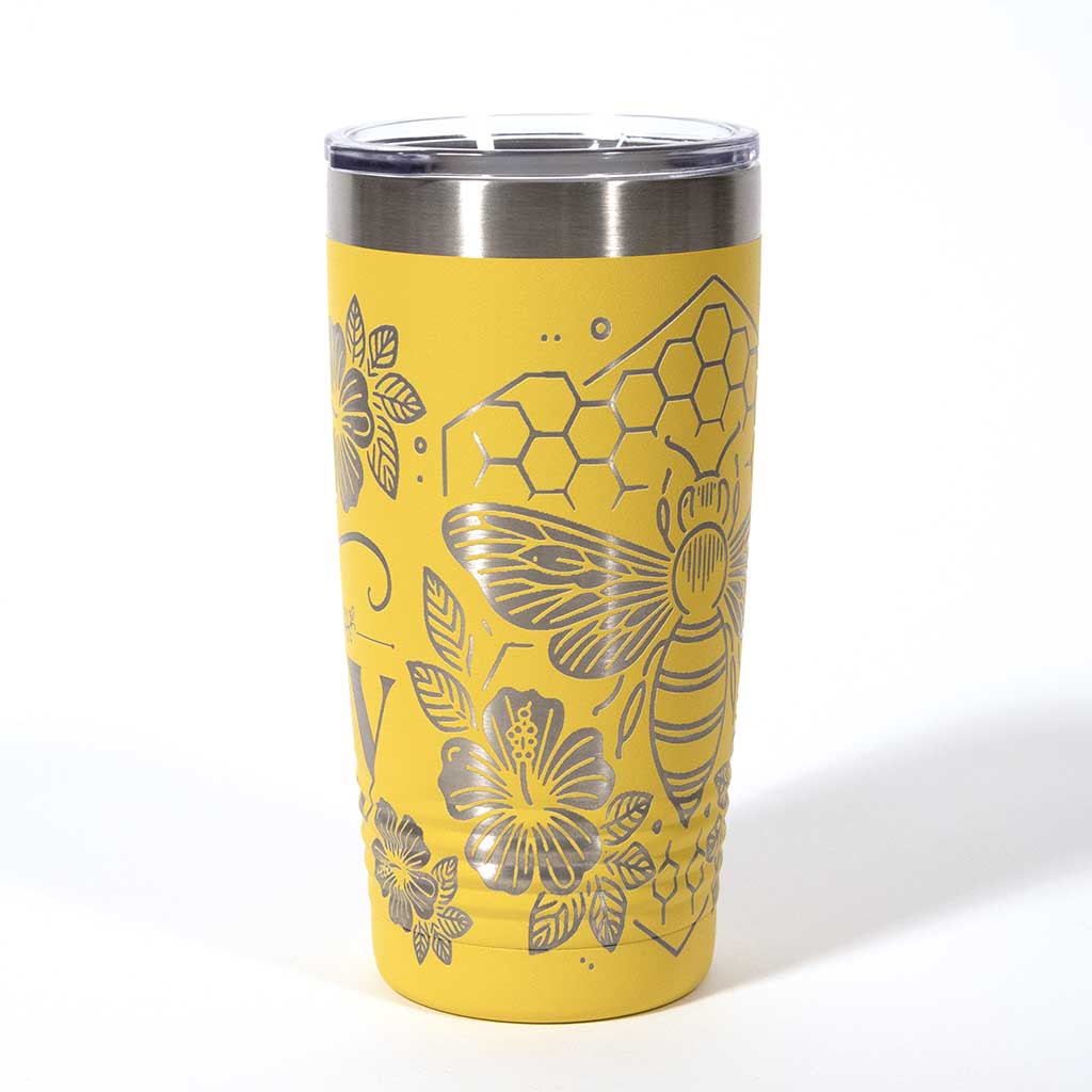Yellow powder coated 20 ounce stainless steel tumbler. Engraved with flowers, a honeycomb and a bee with the words "Bee Happy". Side 4