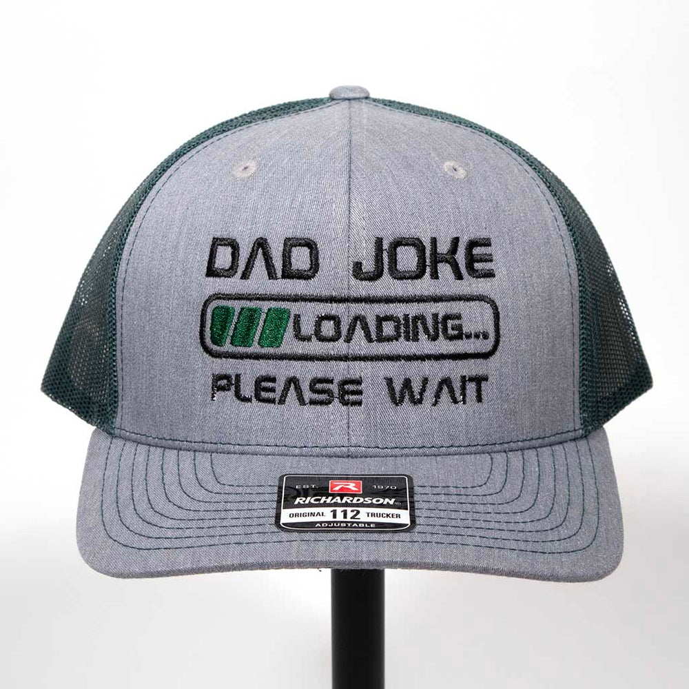 Gray and black cap with 'Dad Joke Loading Please Wait' text on a white background. Richardson 112 hat. 