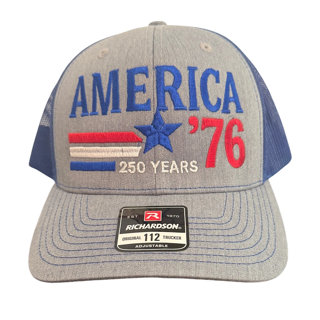 Dailey Woodworking patriotic trucker hat with gray front, blue mesh back, and America 250 Years 76 embroidery.