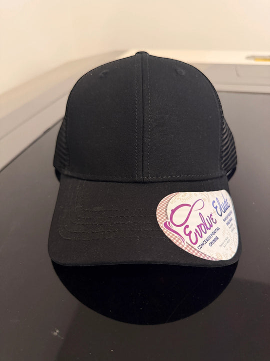 Dailey Woodworking black ponytail trucker hat with a breathable mesh back and a pre-curved visor.