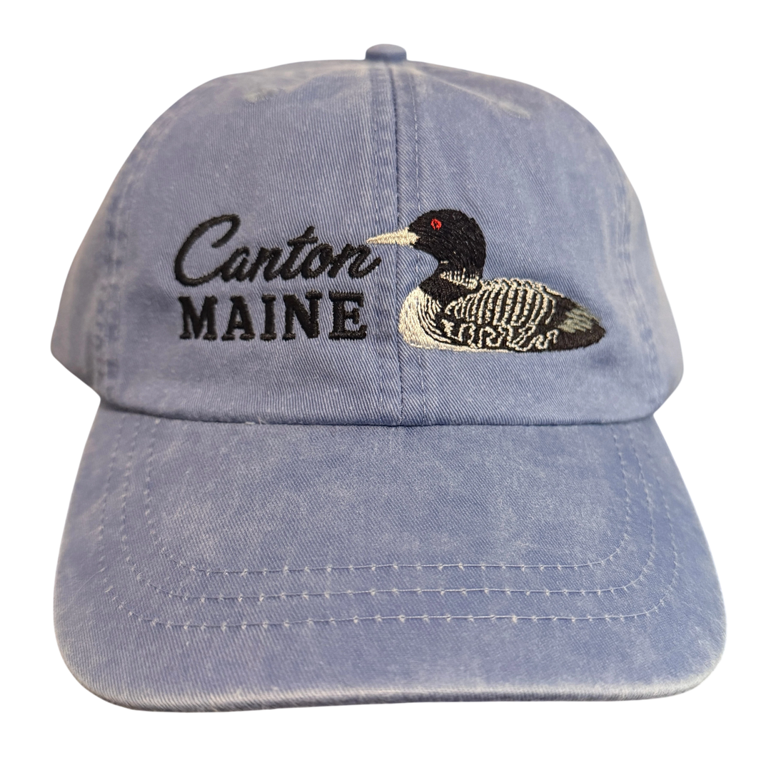 Dailey Woodworking light blue garment-washed cotton baseball cap with embroidered Canton Maine text and a loon design.