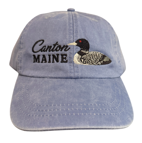 Dailey Woodworking light blue garment-washed cotton baseball cap with embroidered Canton Maine text and a loon design.