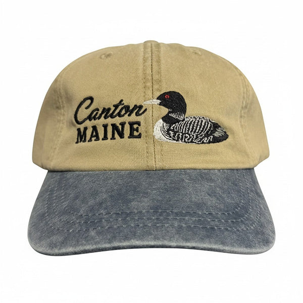 Dailey Woodworking two-tone khaki and blue cotton hat with embroidered Canton Maine text and a loon design.
