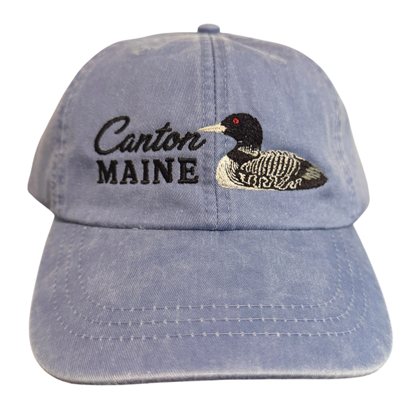Dailey Woodworking light blue garment-washed cotton baseball cap with embroidered Canton Maine text and a loon design.