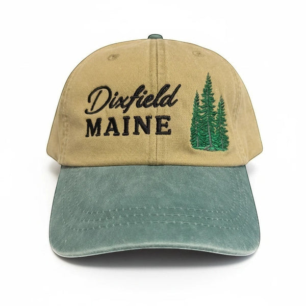 Dailey Woodworking unstructured cotton hat in tan and sage green with Dixfield Maine pine tree embroidery.