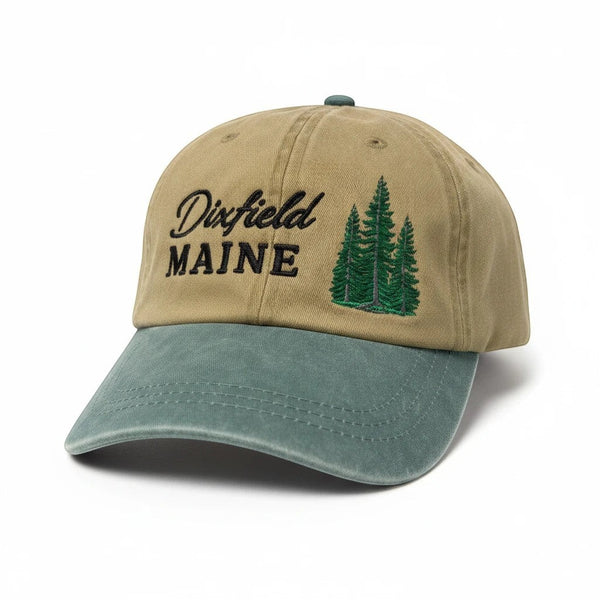 Dailey Woodworking unstructured cotton hat in tan and sage green with Dixfield Maine pine tree embroidery.