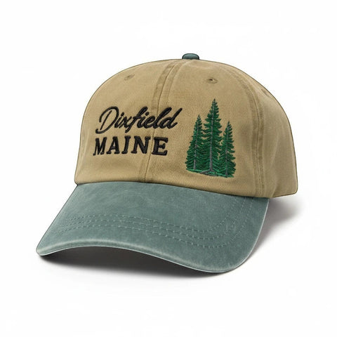 Dailey Woodworking khaki and sage green cotton hat with Dixfield Maine pine tree embroidery and pre-curved visor