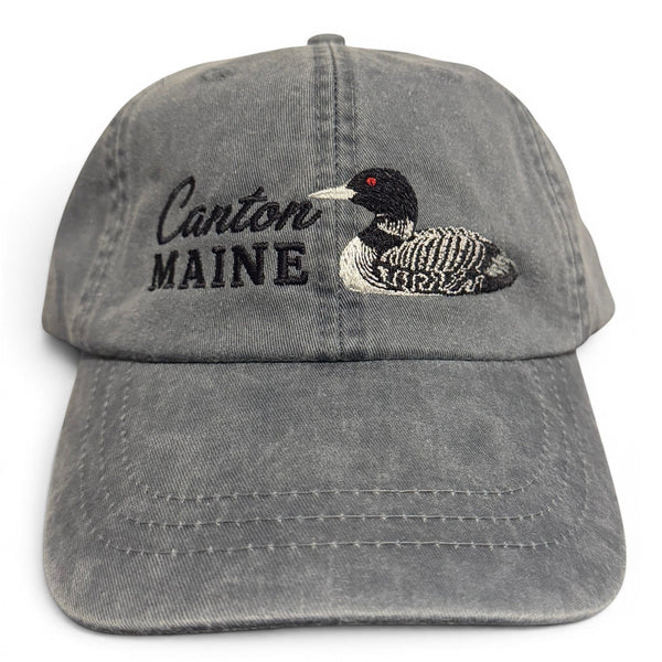Dailey Woodworking grey cotton baseball cap with embroidered Canton Maine lettering and a detailed loon design.