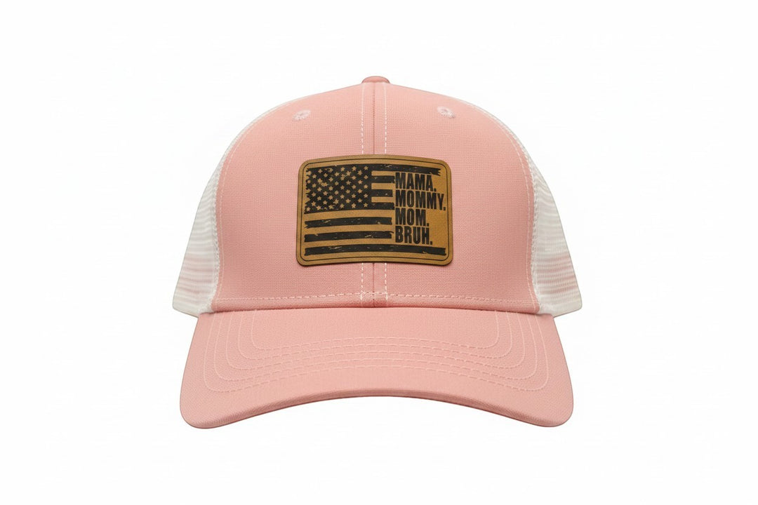 Dailey Woodworking dusty rose trucker hat with white mesh back and leather patch reading "Mama. Mommy. Mom. Bruh."