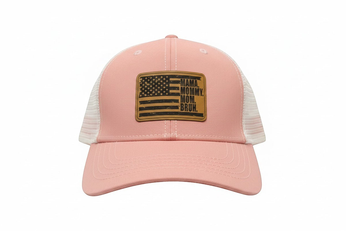 Dailey Woodworking dusty rose trucker hat with white mesh back and leather patch reading "Mama. Mommy. Mom. Bruh."