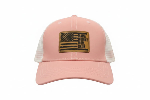 Dailey Woodworking dusty rose trucker hat with white mesh back and leather patch reading "Mama. Mommy. Mom. Bruh."
