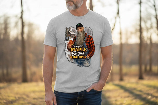 Dailey Woodworking light grey short sleeve t-shirt with a graphic of a bearded man in overalls holding a maple leaf, saying "I&