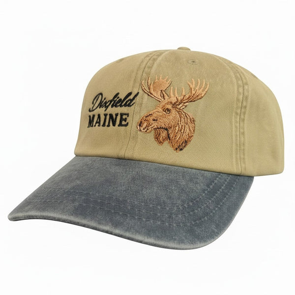 Dailey Woodworking khaki and grey garment-washed cotton dad hat with embroidered moose and Dixfield, Maine text.