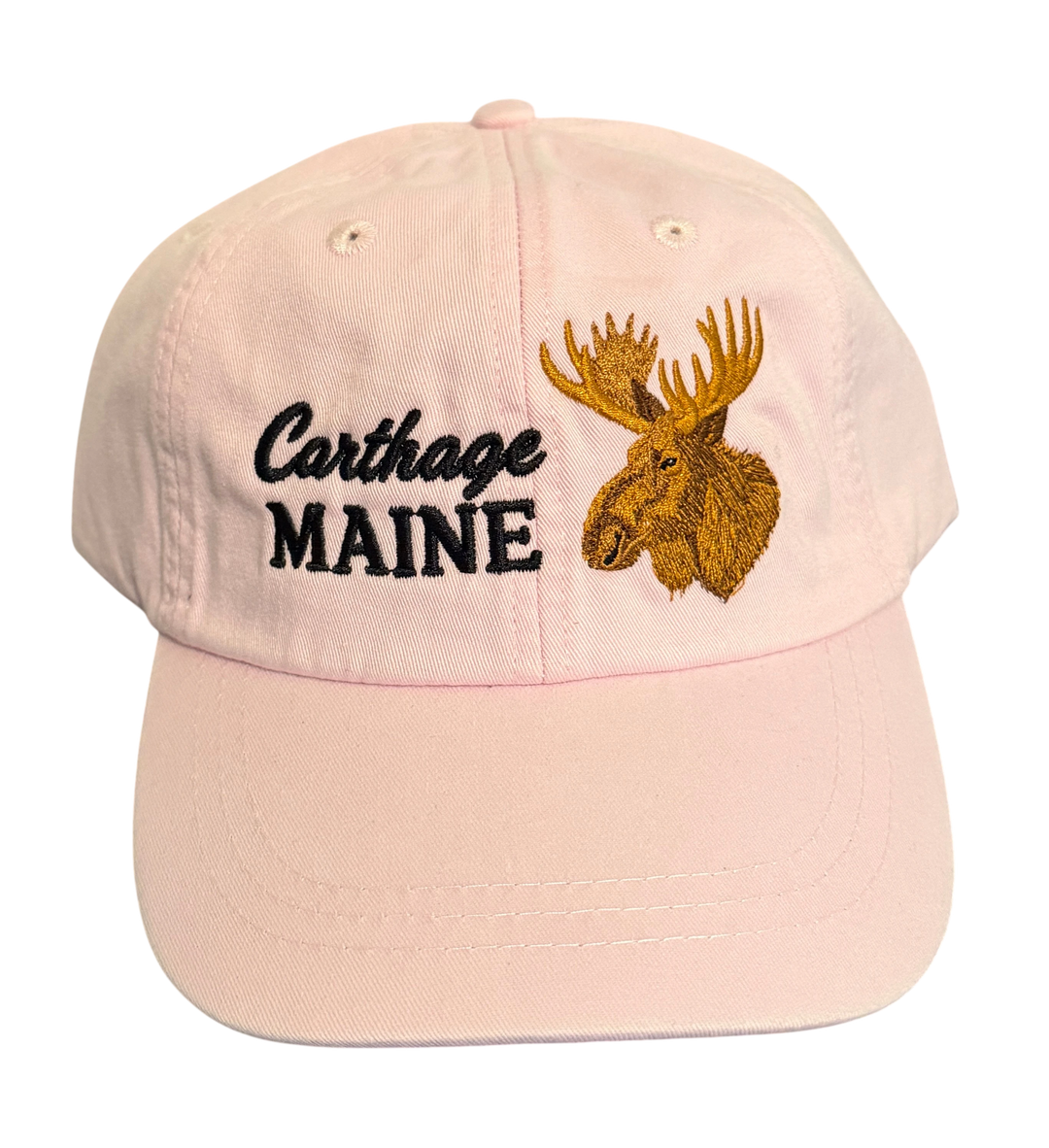 Dailey Woodworking light pink cotton dad hat featuring a bull moose and Carthage Maine embroidery on the front