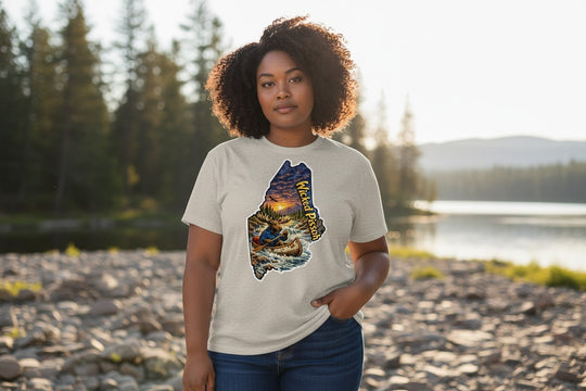 Dailey Woodworking light grey short sleeve t-shirt with a graphic of Maine featuring a moose in a canoe, sunset, and "Wicked Pissah" text.