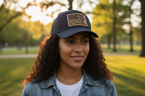 Dailey Woodworking navy blue trucker hat with leather patch featuring distressed American flag and "Mama. Mommy. Mom. Bruh." text.