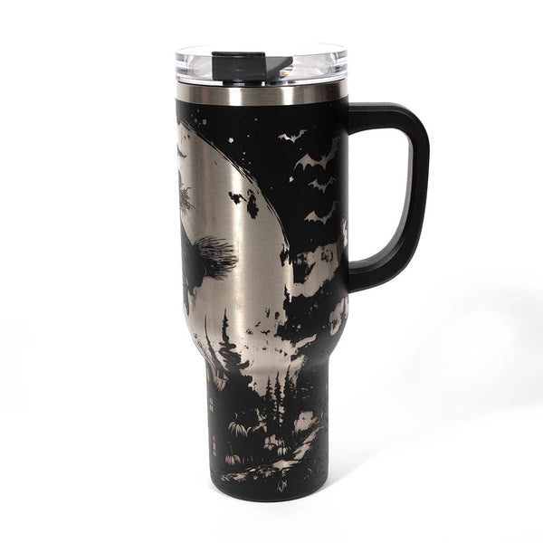 This is a black 40 ounce tumbler with a screw on lid with a drinking hole access and a straw. The laser engraving is of a witch flying on her broom above a home and pumpkin patch. Side 3