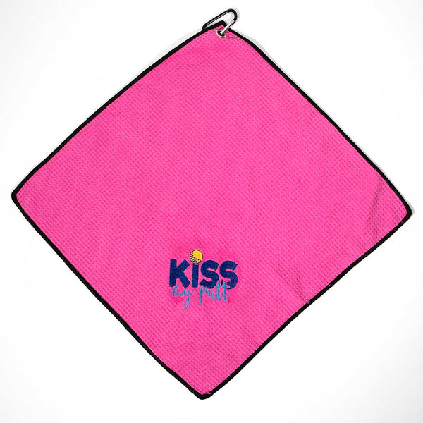 Pink golf towel with 'KISS MY PUTT' text in gold  and dark and light blue