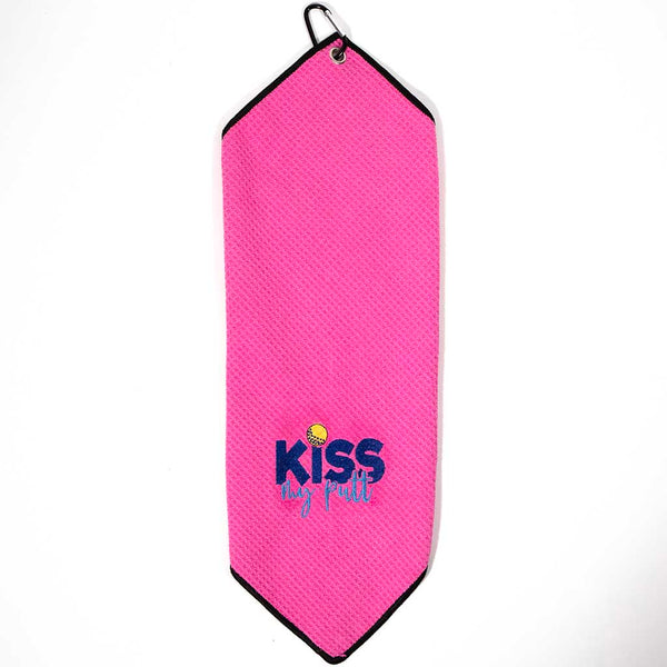 Folded pink golf towel with 'KISS MY PUTT' text in gold  and dark and light blue