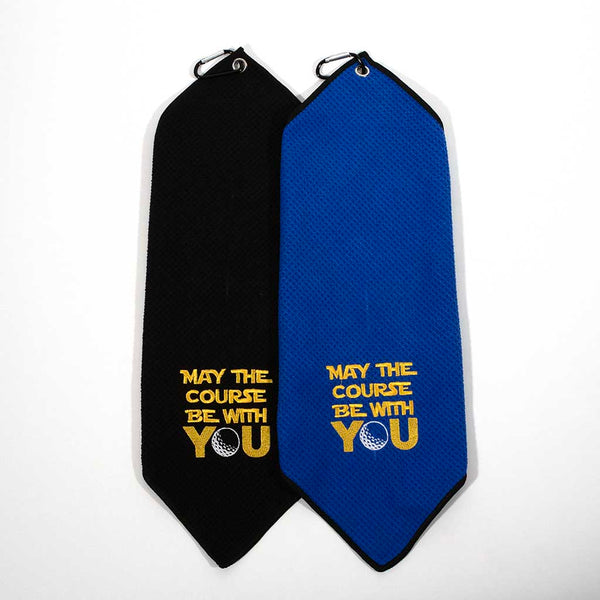 These are folded golf towels, one black and one blue. They both have "MAY THE COURSE BE WITH YOU" embroidered on them. 