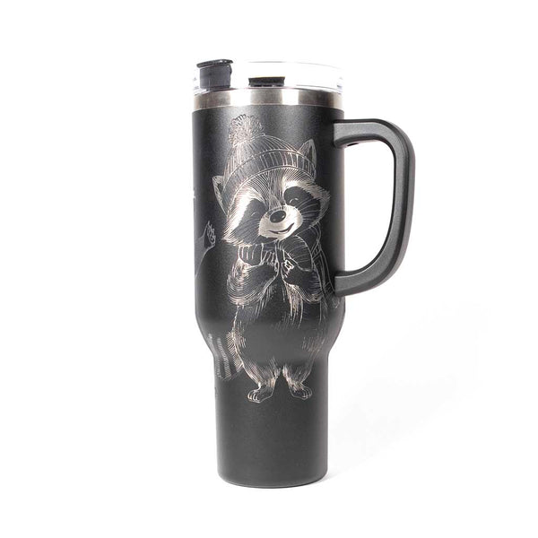 40 ounce black travel mug with three engraved raccoons dressed in scarves and hats. Side 3