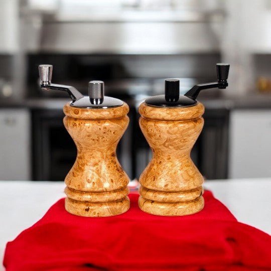 Set of Ferris mini-grinders made in Maple Burl sitting on a red towel with blurred kitchen background - Dailey Woodworking