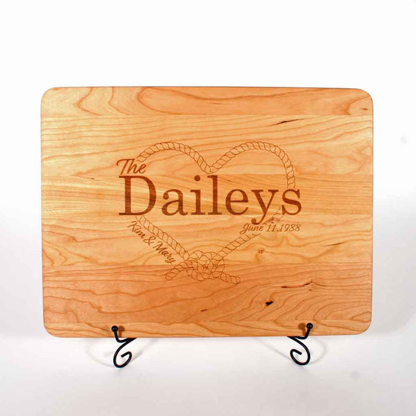 Cherry cutting board custom laser engraved with rope heart and couples names and date of marriage - Dailey Woodworking